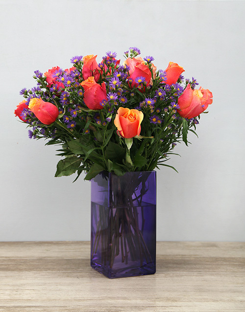 Cherry Brandy Roses in Purple Vase