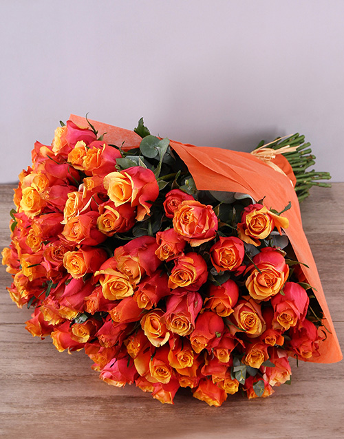 Cherry Brandy Roses In Orange Wrapping