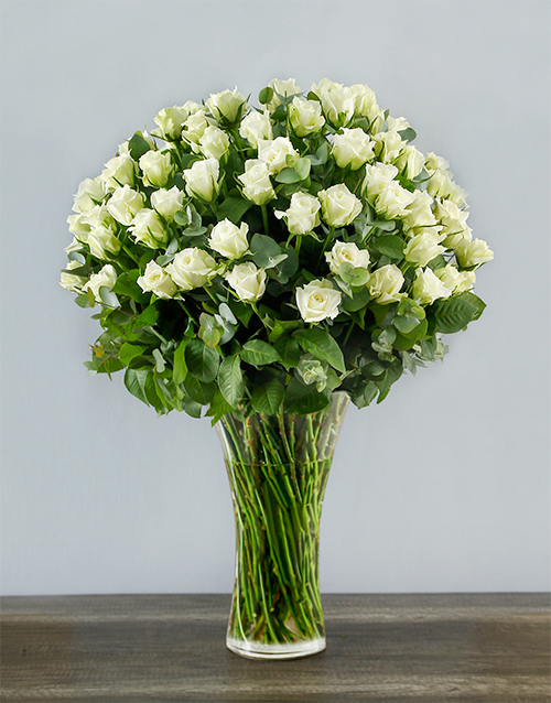 100 White Roses in a Tall Glass Vase