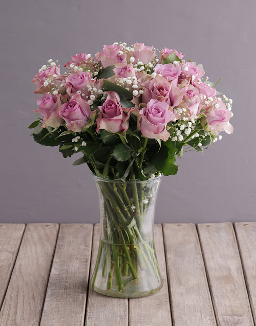 roses Lush Lilac Roses in Glass Vase