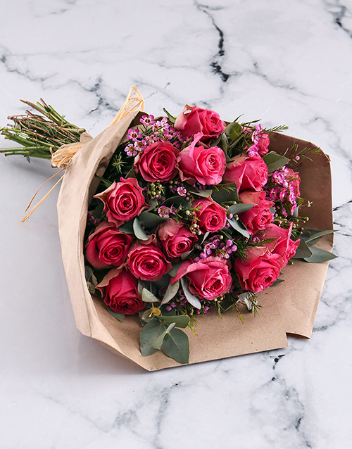 roses Cerise Roses In Brown Paper Wrapping