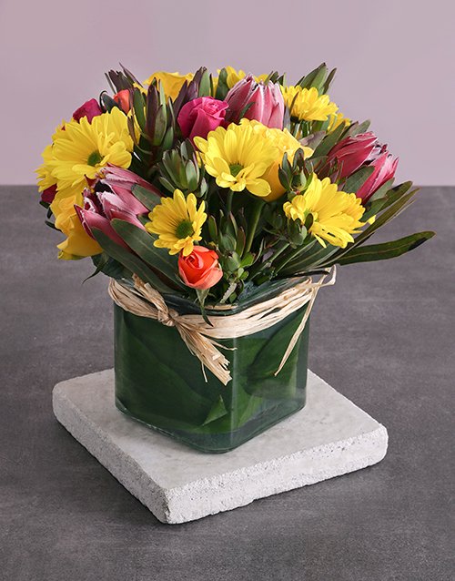 Protea, Roses and Mixed Yellow Blooms in a Vase